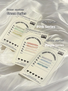 Close-up of vintage receipt memo pads in green, pink, and purple with retro tape designs