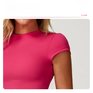 Close-up of flutter sleeve design on a pink slim-fit athletic yoga T-shirt for women