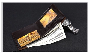 Detail view of deep brown leather bifold wallet with multiple card slots and cash compartment