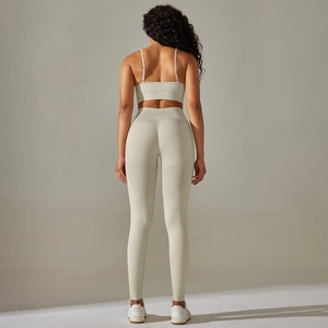 Back view of seamless sports bra and high-waisted yoga leggings in off-white fabric