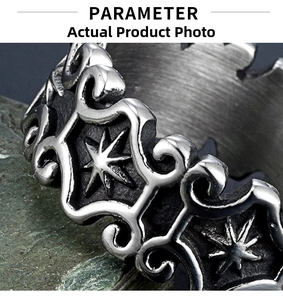 Macro detail of vintage stainless steel ring with embossed sun totem and star patterns