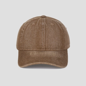 Detail view of washed vintage cotton texture on this earth-toned brown baseball cap