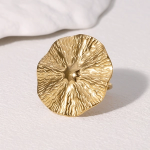 Retro golden stainless steel ring with wave texture and irregular round shape