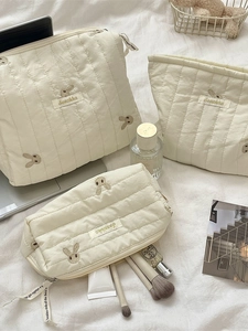 Three-piece quilted cream storage bag set with cute bunny embroidery and zip closure