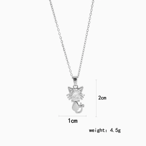 Silver cat pendant necklace with round cubic zirconia stone on white background