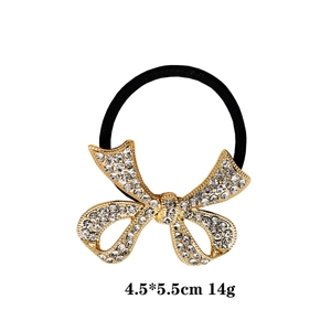 Golden bow ponytail holder with sparkling rhinestones on black elastic band, 4.5x5.5cm
