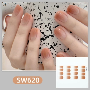 Detail showing gradient brown nail polish stickers with a glossy finish on hands
