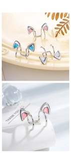 Macro detail of cat ear cuffs in pink blue and silver finish for non-pierced ears