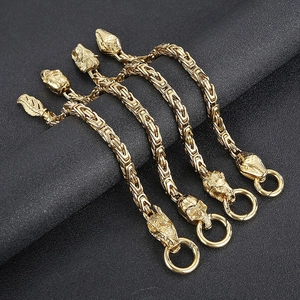 Chaînes byzantines dorées avec charms dragon, crâne, lion et tête de serpent
