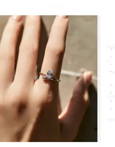 Close-up of s925 silver ring featuring a sparkling oval diamond and bypass line design
