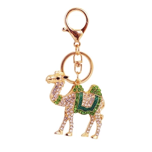 Golden camel keychain accessory with sparkling clear and green rhinestones and ring