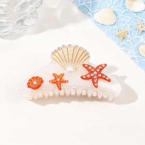 Ocean themed acrylic hair claw clip with golden shells, starfish and pearls for women