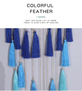 Detailed close-up of blue fringe tassels and hemp rope texture for bohemian wall decor