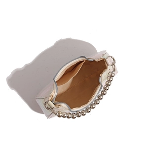 Top view of white pearl crescent bag showing interior khaki lining and silver zipper