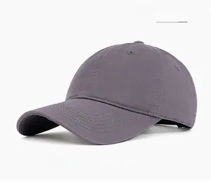 Detail view of dark gray cotton baseball cap with six-panel design and breathable eyelets