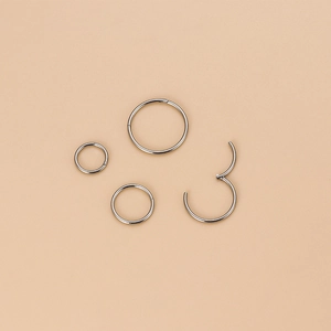 Polished 20g stainless steel segment rings in silver finish for lip and nose piercing