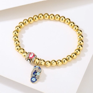 Creative 18K gold-plated beaded bracelet featuring an evil eye and flip-flop charm