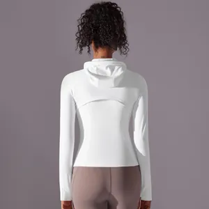 Detail view of the breathable back mesh panel on a white hooded sports jacket for women