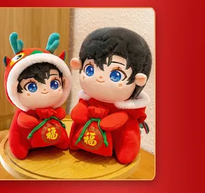 Detailed macro view of festive Chinese New Year mascot plush dolls holding red blessing bags