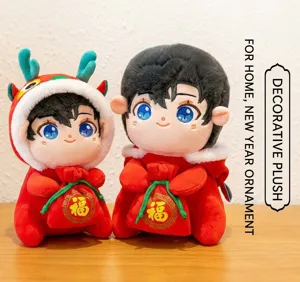 Detailed macro view of festive Chinese New Year mascot plush dolls holding red blessing bags
