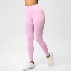 Detail of high-waisted seamless yoga leggings in light pink with breathable knit texture