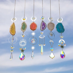 Handmade agate suncatcher set with crystal prisms and gold moon star charms in sunlight