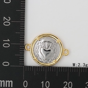 Measurement of two-tone religious heart pendant with scale ruler and weight info
