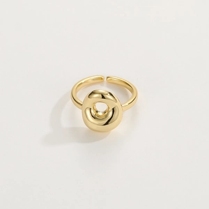 Close-up of 18K gold-plated adjustable open ring featuring hollow round design