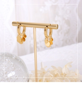 Detailed macro view of 18K gold-plated hoop earrings with multiple hanging round sequins