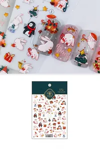 Detail of 5D Christmas nail stickers with rabbit and penguin motifs in relief effect
