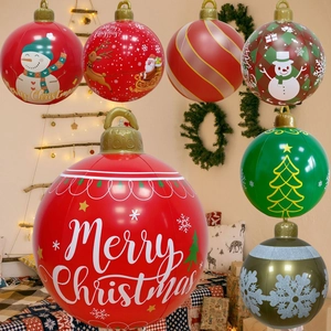 Close-up of inflatable Christmas balls featuring Merry Christmas text and snowman patterns