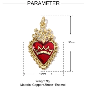 Detail view of heart pendant with crown featuring gold trim and red enamel inlay