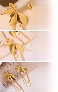 Detail of 18K gold plated tassel earrings with leaf design and natural freshwater pearls