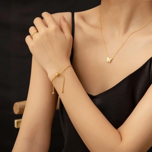 Elegant 18K gold butterfly necklace, adjustable bracelet, and ring set for women
