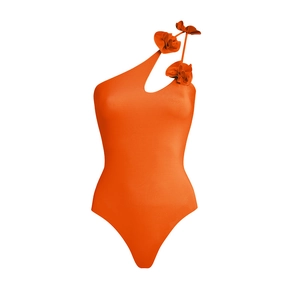 Close-up of bright orange one-piece swimsuit featuring 3D floral appliqués on shoulder