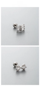 Close-up of titanium steel butterfly earrings with white cubic zirconia inlay and screw back
