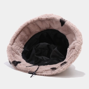 Pink plush bucket hat with black heart pattern and adjustable inner drawstring