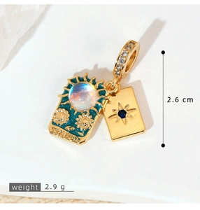 Macro detail of The Sun tarot pendant with blue enamel and sparkling crystal stones