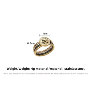 Detail of multi-tone stainless steel Tree of Life ring with crystal inlay and 1cm disc