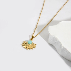 Golden stainless steel sunburst fan pendant necklace with a blue natural stone inlay