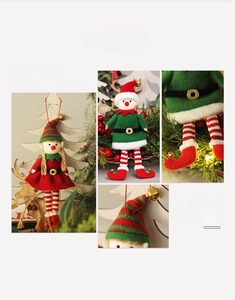 Detail of cute Christmas elf dolls featuring festive striped legs and metallic bell accents