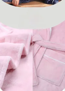 Detail view of pink plush flannel bathrobe featuring shawl collar and large pockets
