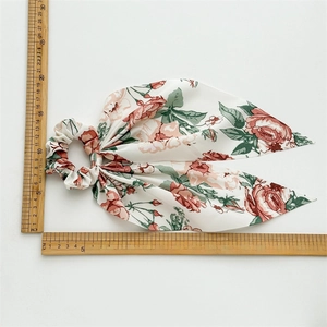Floral print hair scrunchie with long ribbon streamers and measurement dimensions