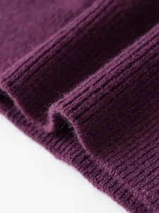 Close-up of purple ribbed knit fabric texture showing vertical stripe structure