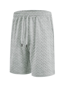Detail showing the light grey jacquard waffle texture and drawstring waistband of men's shorts
