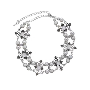 Close-up of Y2K silver choker with grey pearls and dark gemstones multi-layer chain