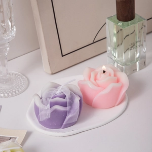 Pink and purple rose scented candles in a decorative tray for home ambiance and gifts