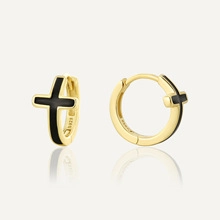 Detail of S925 sterling silver gold hoop earrings with black enamel cross pendant