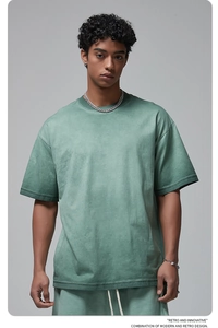 Detail of sage green cotton t-shirt and drawstring shorts set with retro typography