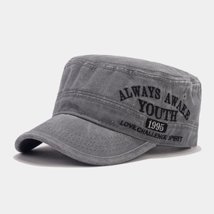 Detail of vintage washed charcoal cotton cadet cap featuring embroidered street style lettering